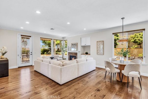 Dining room, Fireplace, Interior, Living room, Recessed Lighting, Wood Texture Flooring