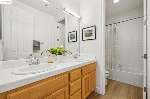 Bathroom, Dual Sink Vanities, Interior, Recessed Lighting, Tile Countertops, Wood Texture Flooring
