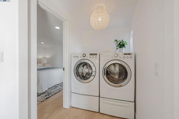 Bedroom, Interior, Recessed Lighting, Utility Closets, Washer, Wood Texture Flooring