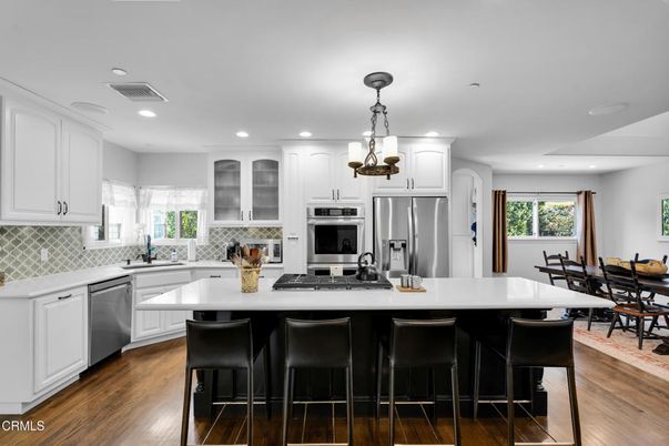 Dining room, Interior, Kitchen, Pendant Lights, Recessed Lighting, Stainless Steel Appliances, Wood Texture Flooring