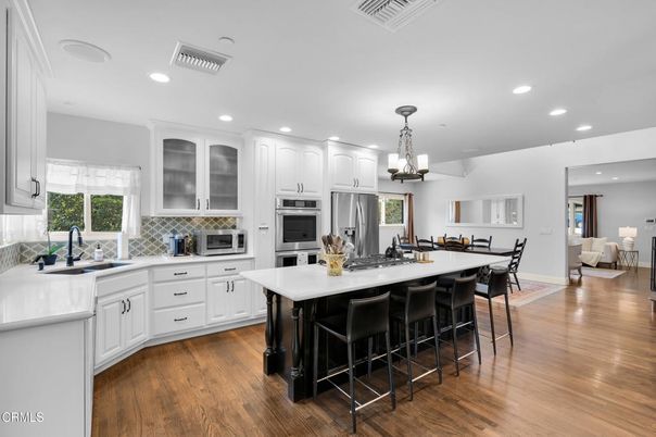Dining room, Interior, Kitchen, Recessed Lighting, Stainless Steel Appliances, Wood Texture Flooring