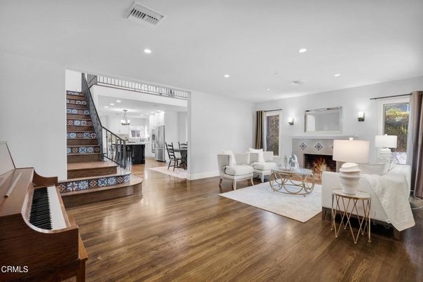 Dining room, Fireplace, Interior, Living room, Piano, Recessed Lighting, Wood Texture Flooring