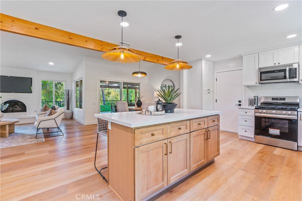 Fireplace, Interior, Kitchen, Living room, Pendant Lights, Recessed Lighting, Stainless Steel Appliances, Wooden Beams, Wood Texture Flooring