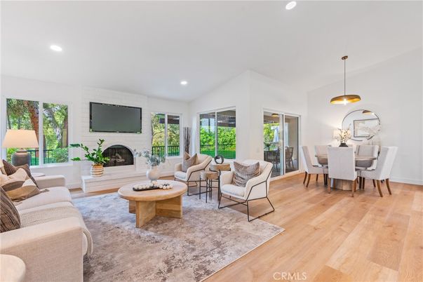 Dining room, Fireplace, Interior, Living room, Pendant Lights, Recessed Lighting, Wood Texture Flooring
