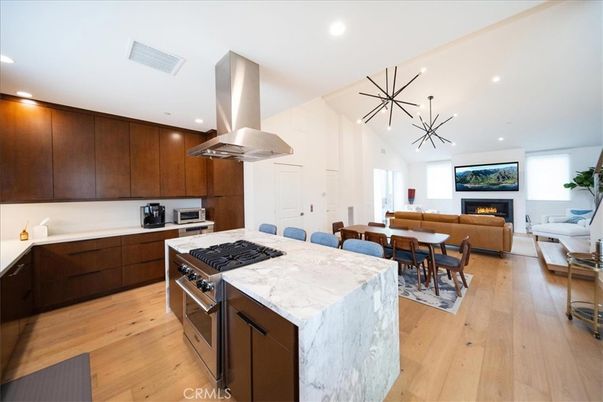 Dining room, Fireplace, Interior, Kitchen, Living room, Pendant Lights, Recessed Lighting, Stainless Steel Appliances, Wood Texture Flooring