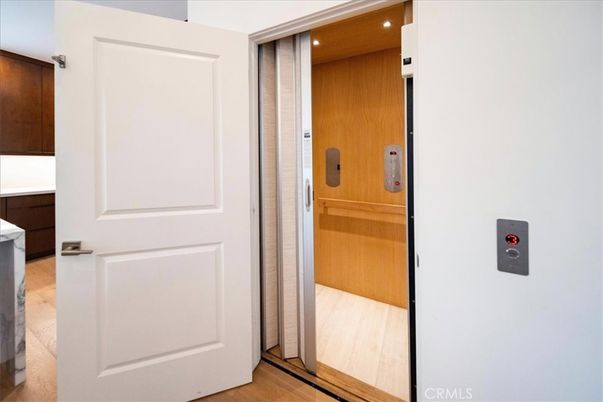 Elevator, Interior, Recessed Lighting, Wood Texture Flooring, Wooden Walls