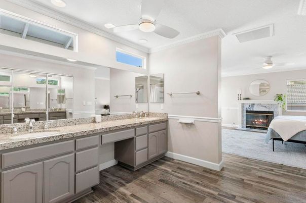 Bathroom, Dual Sink Vanities, Fireplace, Interior, Recessed Lighting, Wood Texture Flooring