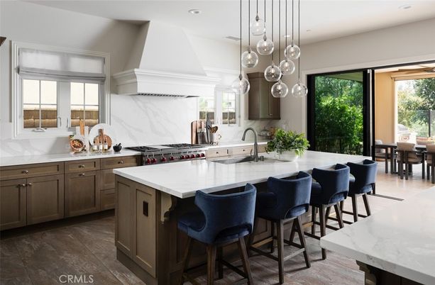 Interior, Kitchen, Marble Walls, Pendant Lights, Recessed Lighting, Stainless Steel Appliances