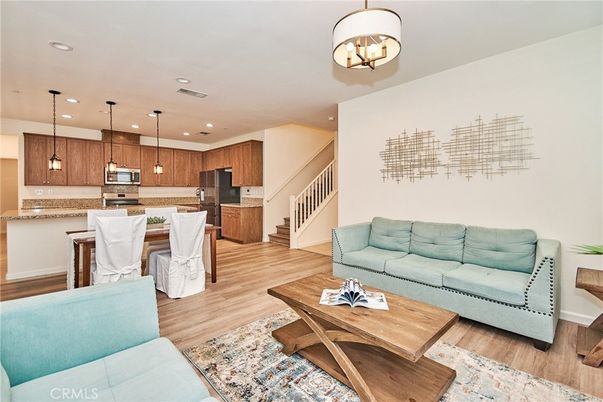 Dining room, Interior, Kitchen, Living room, Pendant Lights, Recessed Lighting, Stainless Steel Appliances, Wood Texture Flooring