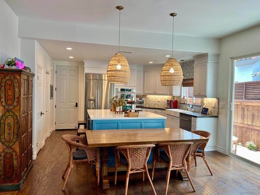 Dining room, Interior, Kitchen, Pendant Lights, Recessed Lighting, Stainless Steel Appliances, Wood Texture Flooring