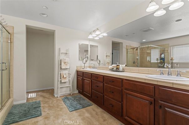 Bathroom, Dual Sink Vanities, Glass Shower, Interior, Recessed Lighting, Tile Countertops