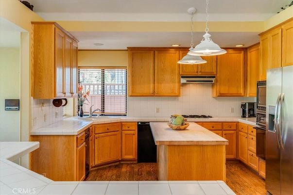 Interior, Kitchen, Pendant Lights, Recessed Lighting, Tile Countertops, Wood Texture Flooring