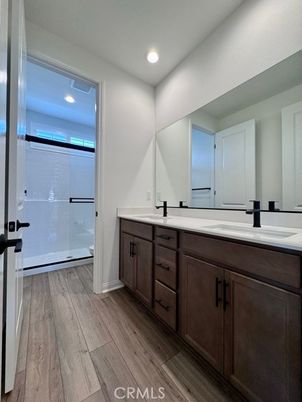 Bathroom, Dual Sink Vanities, Interior, Recessed Lighting, Wood Texture Flooring