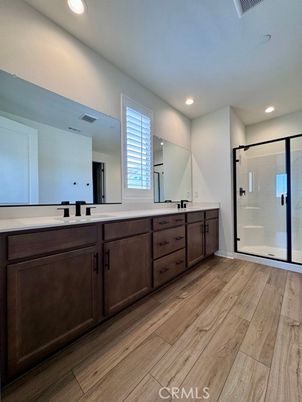 Bathroom, Dual Sink Vanities, Glass Shower, Interior, Recessed Lighting, Wood Texture Flooring