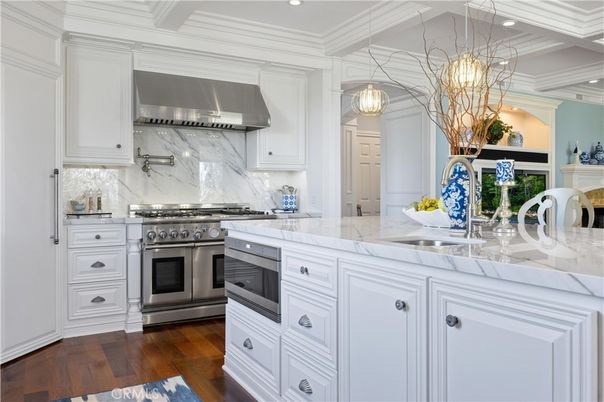 Interior, Kitchen, Marble Walls, Pendant Lights, Recessed Lighting, Stainless Steel Appliances, Wood Texture Flooring
