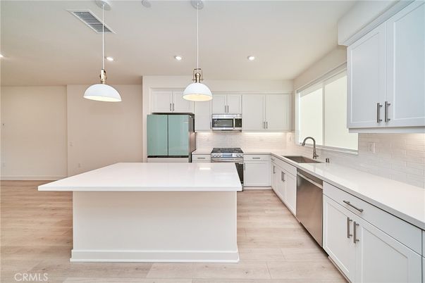 Interior, Kitchen, Pendant Lights, Recessed Lighting, Stainless Steel Appliances, Wood Texture Flooring
