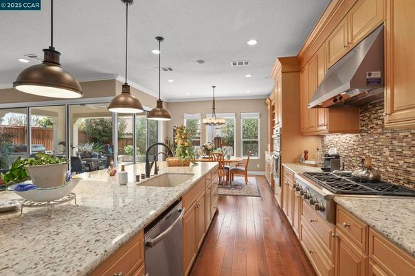 Dining room, Interior, Kitchen, Pendant Lights, Recessed Lighting, Stainless Steel Appliances, Wood Texture Flooring