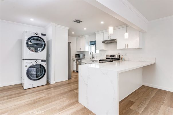 Interior, Kitchen, Pendant Lights, Recessed Lighting, Stainless Steel Appliances, Washer, Wood Texture Flooring
