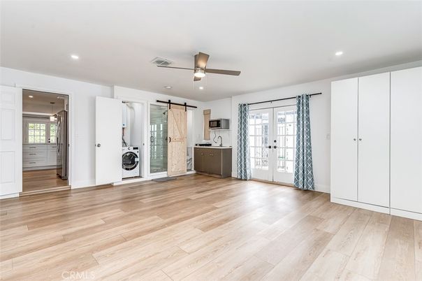 Empty room, Interior, Kitchen, Recessed Lighting, Washer, Wood Texture Flooring