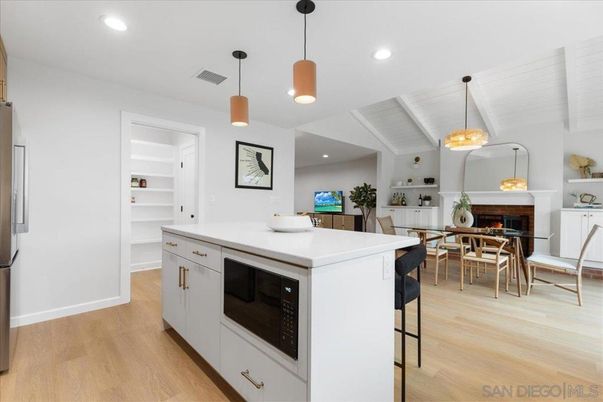 Dining room, Fireplace, Interior, Kitchen, Pendant Lights, Recessed Lighting, Wood Texture Flooring