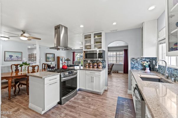 Dining room, Interior, Kitchen, Recessed Lighting, Stainless Steel Appliances, Wood Texture Flooring