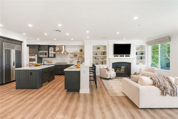 Fireplace, Interior, Kitchen, Living room, Recessed Lighting, Stainless Steel Appliances, Wood Texture Flooring