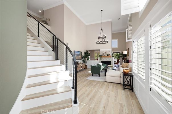 Chandelier, Fireplace, Interior, Living room, Pendant Lights, Recessed Lighting, Wood Texture Flooring
