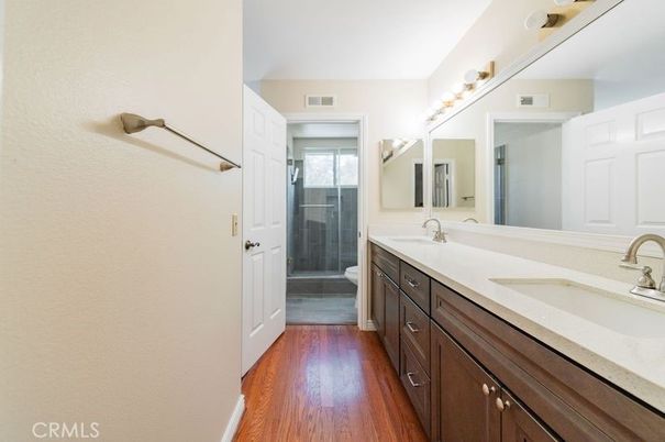 Bathroom, Dual Sink Vanities, Glass Shower, Interior, Wood Texture Flooring