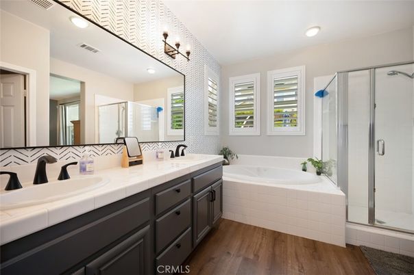 Bathroom, Dual Sink Vanities, Glass Shower, Interior, Recessed Lighting, Tile Countertops, Wood Texture Flooring