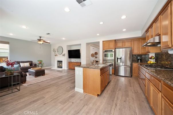 Fireplace, Interior, Kitchen, Living room, Recessed Lighting, Stainless Steel Appliances, Wood Texture Flooring