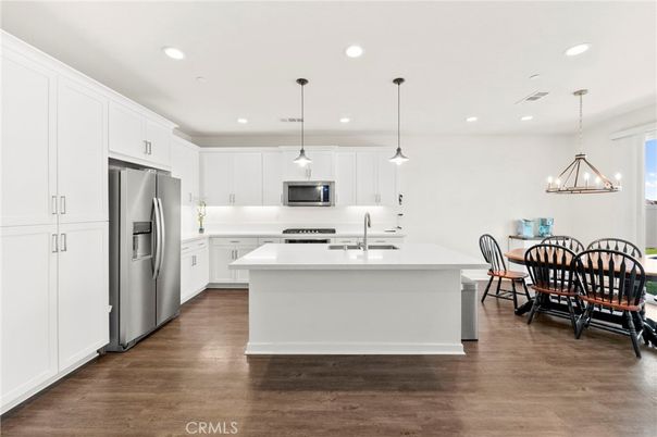 Dining room, Interior, Kitchen, Pendant Lights, Recessed Lighting, Stainless Steel Appliances, Wood Texture Flooring