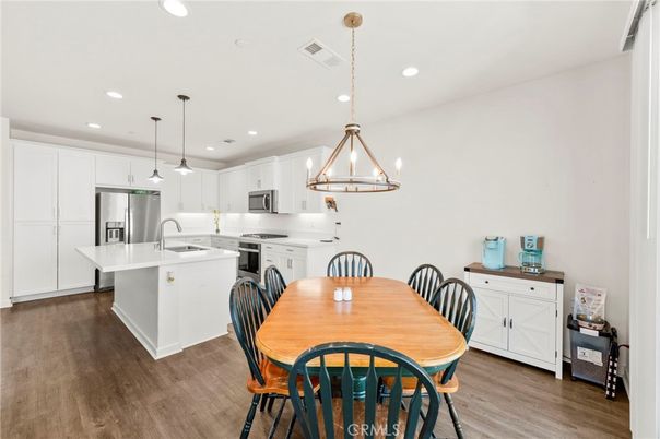Dining room, Interior, Kitchen, Pendant Lights, Recessed Lighting, Stainless Steel Appliances, Wood Texture Flooring