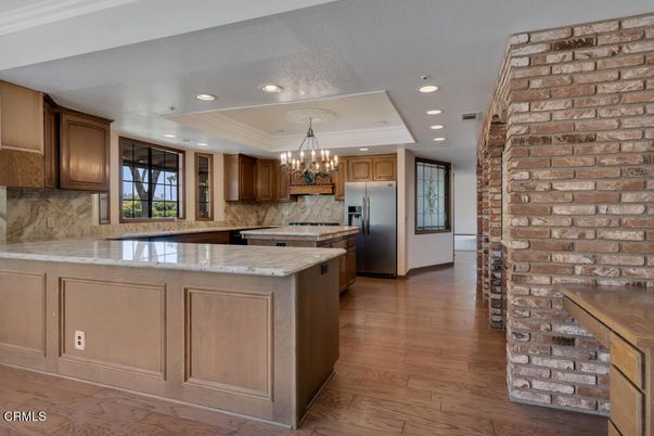 Chandelier, Interior, Kitchen, Recessed Lighting, Stainless Steel Appliances, Stone Walls, Wood Texture Flooring