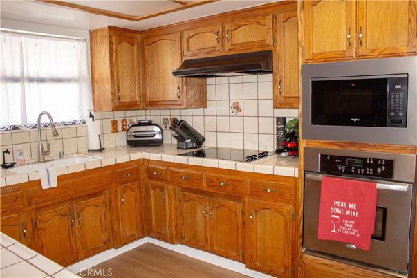 Interior, Kitchen, Tile Countertops, Wood Texture Flooring