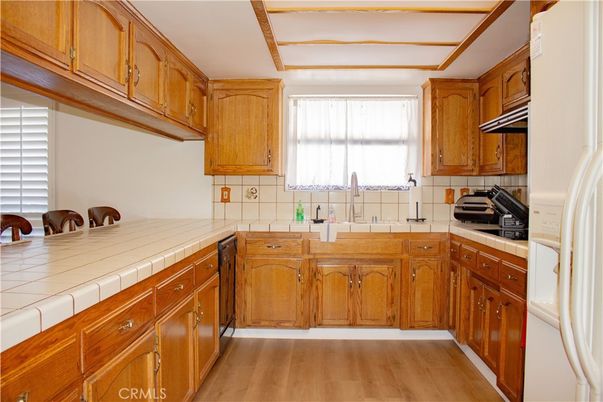Interior, Kitchen, Tile Countertops, Wood Texture Flooring