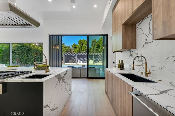 Interior, Kitchen, Marble Walls, Recessed Lighting, Stainless Steel Appliances, Wood Texture Flooring