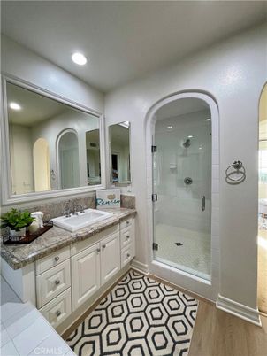 Bathroom, Dual Sink Vanities, Glass Shower, Interior, Recessed Lighting, Wood Texture Flooring