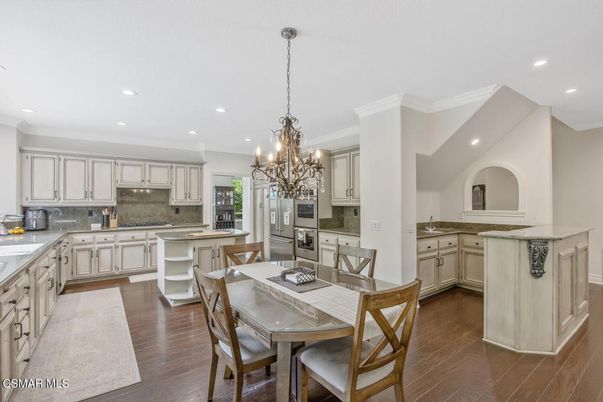Chandelier, Dining room, Interior, Kitchen, Recessed Lighting, Stainless Steel Appliances, Wood Texture Flooring