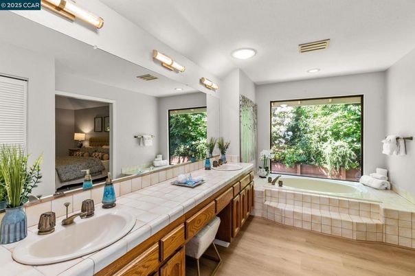 Bathroom, Dual Sink Vanities, Interior, Recessed Lighting, Tile Countertops, Wood Texture Flooring