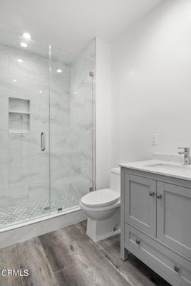 Bathroom, Glass Shower, Interior, Marble Walls, Recessed Lighting, Wood Texture Flooring