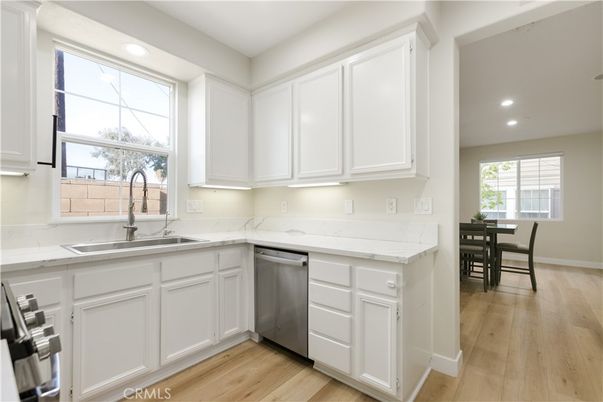 Dining room, Interior, Kitchen, Recessed Lighting, Stainless Steel Appliances, Wood Texture Flooring