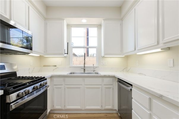 Interior, Kitchen, Recessed Lighting, Stainless Steel Appliances, Wood Texture Flooring