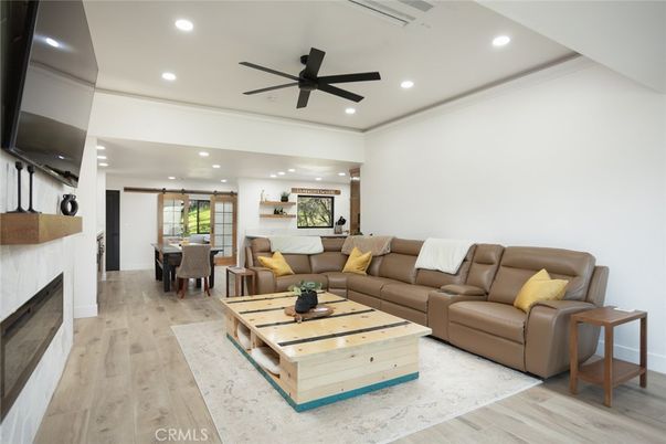 Dining room, Fireplace, Interior, Living room, Recessed Lighting, Wood Texture Flooring