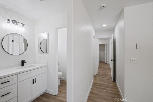 Bathroom, Dual Sink Vanities, Interior, Recessed Lighting, Wood Texture Flooring