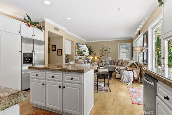 Chandelier, Interior, Kitchen, Living room, Recessed Lighting, Stainless Steel Appliances, Wood Texture Flooring