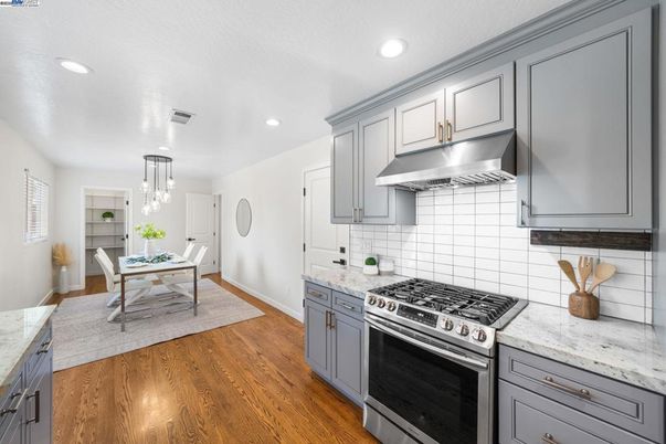 Dining room, Interior, Kitchen, Pendant Lights, Recessed Lighting, Stainless Steel Appliances, Wood Texture Flooring
