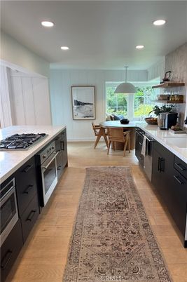 Dining room, Interior, Kitchen, Pendant Lights, Recessed Lighting, Stainless Steel Appliances, Wood Texture Flooring