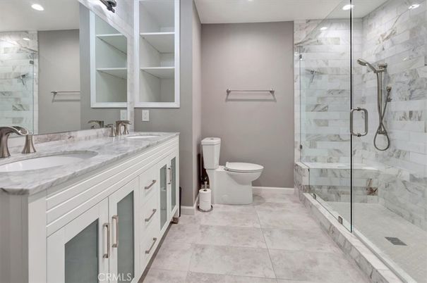 Bathroom, Dual Sink Vanities, Glass Shower, Interior, Marble Walls, Recessed Lighting