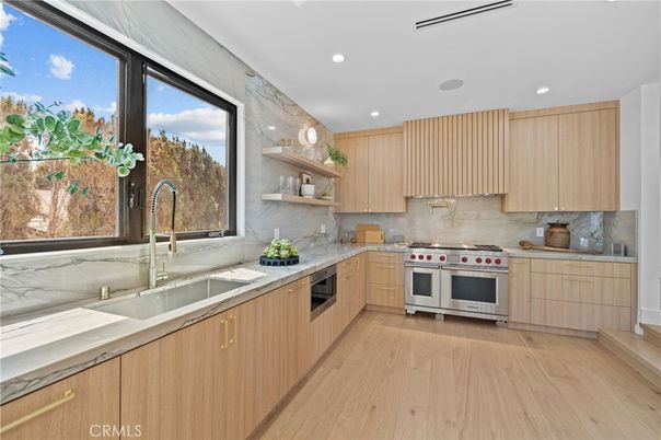 Interior, Kitchen, Marble Walls, Recessed Lighting, Stainless Steel Appliances, Wood Texture Flooring