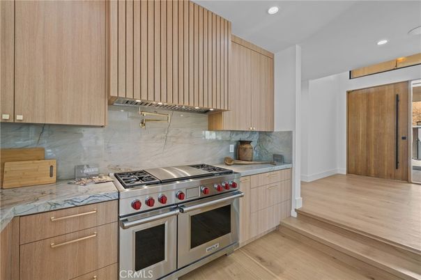 Interior, Kitchen, Marble Walls, Recessed Lighting, Stainless Steel Appliances, Wood Texture Flooring